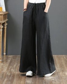 Pantalon large taille haute de couleur unie