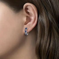 Boucles d'oreilles avec blason royal et pierres précieuses