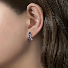 Boucles d'oreilles avec blason royal et pierres précieuses