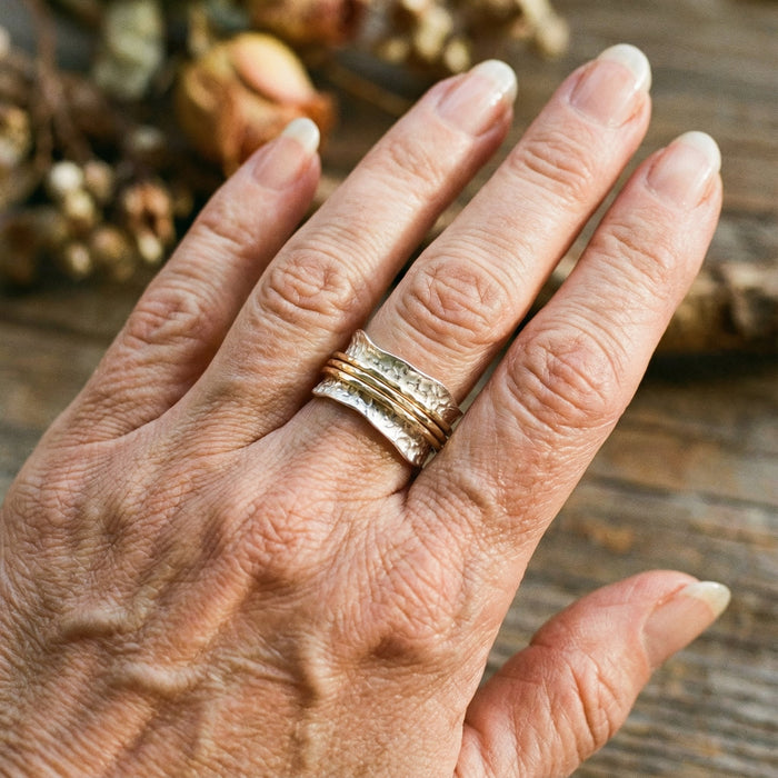 Bague vintage fine rotative en doré et argenté