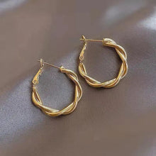Boucles d'oreilles élégantes en or avec nœud